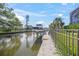 Waterfront view of a private boat dock on a canal, offering convenient access to the water at 5569 Cape Leyte Dr, Sarasota, FL 34242