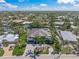 Stunning waterfront home boasts lush landscaping and a circular driveway at 5569 Cape Leyte Dr, Sarasota, FL 34242