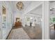Spacious foyer offering a glimpse of the living and dining areas, and a decorative pendant light at 5569 Cape Leyte Dr, Sarasota, FL 34242
