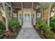 Inviting front entrance with meticulously landscaped walkway leading to the front door at 5569 Cape Leyte Dr, Sarasota, FL 34242