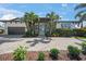 Beautiful two-story home featuring a lush landscaped yard and charming curb appeal at 5569 Cape Leyte Dr, Sarasota, FL 34242