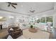 Bright and airy living room with ample seating and views of the pool at 5569 Cape Leyte Dr, Sarasota, FL 34242