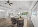 Bright and airy living room with ample seating and views of the pool at 5569 Cape Leyte Dr, Sarasota, FL 34242