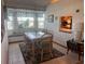 Charming dining area with large windows and a cozy window seat at 620 Camellia Ave, Ellenton, FL 34222