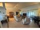 Inviting living room with tile floors, comfortable seating and lots of natural light at 620 Camellia Ave, Ellenton, FL 34222