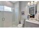 Bathroom featuring tiled walk-in shower, white subway tiles, and modern vanity with sink at 6219 Golden Nettle Dr, Apollo Beach, FL 33572