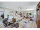 Bright living room featuring an open-concept layout, light wood floors, and comfortable seating at 6219 Golden Nettle Dr, Apollo Beach, FL 33572
