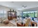 The cozy living room offers a large sectional sofa, entertainment center, and sliding door access to the patio at 6219 Golden Nettle Dr, Apollo Beach, FL 33572