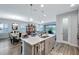 Open living space features views to the kitchen and dining areas, as well as sliding door access to the outdoor space at 6219 Golden Nettle Dr, Apollo Beach, FL 33572