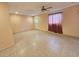 Clean bedroom featuring neutral walls and tile floors along with a ceiling fan to keep it cool at 6305 Bikini Rd, Sarasota, FL 34241