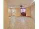 Large bonus room featuring neutral tile floors and an exterior door at 6305 Bikini Rd, Sarasota, FL 34241
