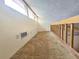 Bonus room with carpeting, natural light from high windows and wooden safety rails at 6305 Bikini Rd, Sarasota, FL 34241