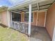 Inviting front porch with white railings, offering a cozy outdoor space at 6305 Bikini Rd, Sarasota, FL 34241