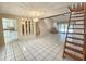 Bright living room with ceramic tile floors, showcasing the open layout at 6305 Bikini Rd, Sarasota, FL 34241