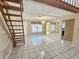 Spacious living room with tiled flooring, bright natural light, and access to the dining room at 6305 Bikini Rd, Sarasota, FL 34241