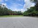 Street view showcasing a paved road with foliage in the background at 6305 Bikini Rd, Sarasota, FL 34241