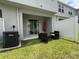 Beautiful backyard, featuring stylish patio furniture set and shade umbrella at 6358 Fairmont Ln, Palmetto, FL 34221