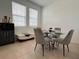 Stylish dining area with ample natural light, modern furnishings, and neutral color palette at 6358 Fairmont Ln, Palmetto, FL 34221