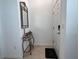 Inviting entryway with a decorative mirror above a table, and a door with keyless entry at 6358 Fairmont Ln, Palmetto, FL 34221