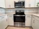 Modern kitchen equipped with stainless steel appliances and white cabinets at 6358 Fairmont Ln, Palmetto, FL 34221