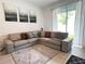 Comfortable living room with a sectional sofa, area rug, and natural light at 6358 Fairmont Ln, Palmetto, FL 34221