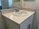 Close-up of a bathroom vanity with a sleek faucet and ample counter space, blending style with functionality at 6358 Fairmont Ln, Palmetto, FL 34221