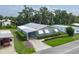 Drone shot showcasing property and neighborhood with manicured lawns at 6710 36 E Ave # 114, Palmetto, FL 34221