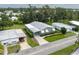 Aerial view of the residence showcasing the roof, manicured landscaping, and community surroundings at 6710 36 E Ave # 114, Palmetto, FL 34221