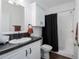 Clean bathroom featuring a shower-tub combo, and a vanity with dark countertop at 6710 36 E Ave # 114, Palmetto, FL 34221