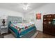 Comfortable bedroom featuring a decorative quilt, and hardwood floors at 6710 36 E Ave # 114, Palmetto, FL 34221