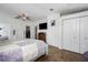 Cozy bedroom with a ceiling fan, walk-in closet, and ensuite bathroom at 6710 36 E Ave # 114, Palmetto, FL 34221