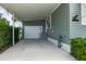 View of carport showcasing attached garage and exterior features at 6710 36 E Ave # 114, Palmetto, FL 34221
