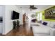 Comfortable living room with a plush sectional sofa and large-screen TV at 6710 36 E Ave # 114, Palmetto, FL 34221
