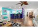Bright, open-concept living room featuring a large island and hardwood floors at 6710 36 E Ave # 114, Palmetto, FL 34221