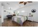 Serene main bedroom with vaulted ceiling, wood floors, and comfortable furnishings at 6710 36 E Ave # 114, Palmetto, FL 34221