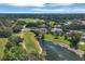 Beautiful aerial view of an expansive golf course community with waterways and luxurious residences at 7133 Dornough Ln, Bradenton, FL 34202