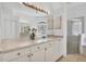 Bright bathroom features a large mirror, a sink, a shower, and lots of natural light at 7133 Dornough Ln, Bradenton, FL 34202