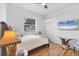Bedroom with a ceiling fan, TV, and a window at 7133 Dornough Ln, Bradenton, FL 34202