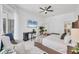 Bright bedroom with a ceiling fan, desk, and lots of natural light at 7133 Dornough Ln, Bradenton, FL 34202