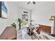 Cozy dining room with a round glass table and unique decor at 7133 Dornough Ln, Bradenton, FL 34202