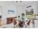 Cozy dining room with a round glass table and unique decor at 7133 Dornough Ln, Bradenton, FL 34202