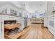 Well-appointed kitchen with custom pull-out shelves and stainless steel appliances opens to the living area at 7133 Dornough Ln, Bradenton, FL 34202