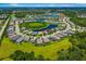 Gorgeous aerial view of homes surrounding lake with lush green spaces in the residential community at 773 Rosemary Cir, Bradenton, FL 34212