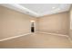 A spacious carpeted bedroom with a glimpse of an ensuite bathroom at 773 Rosemary Cir, Bradenton, FL 34212