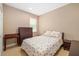 This bedroom offers a comfortable sleeping space with a queen bed, dresser, and window for natural light at 773 Rosemary Cir, Bradenton, FL 34212