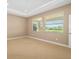 Bright bedroom with two windows and plush carpeting at 773 Rosemary Cir, Bradenton, FL 34212