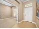 Open entryway and office provides an inviting ambiance with natural light and serene views at 773 Rosemary Cir, Bradenton, FL 34212