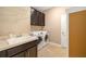 A functional laundry room featuring tile flooring, sink, and washer/dryer at 773 Rosemary Cir, Bradenton, FL 34212