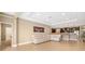 Open concept living room featuring tile flooring and a large white sectional sofa at 773 Rosemary Cir, Bradenton, FL 34212