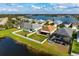 Home's backyard featuring a pond view and screened-in patio at 7750 Ridgelake Cir, Bradenton, FL 34203